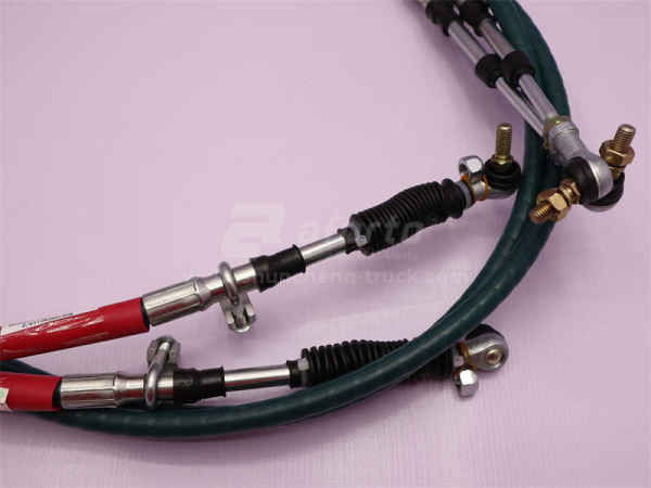 Трос переключения передач КПП HOWO 2008/SHAANXI F3000 3.4M красный (оригинал)